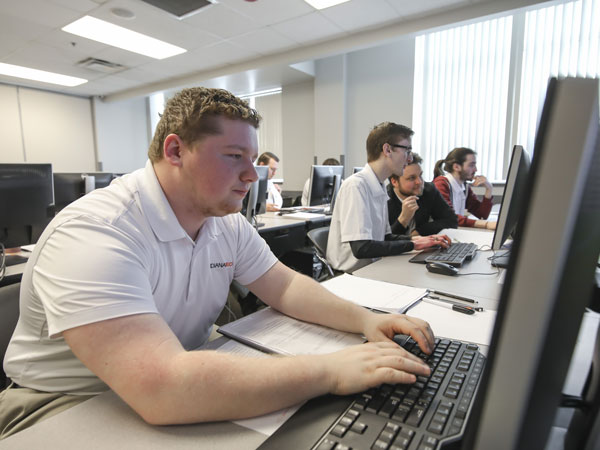 Cyber Warriors team in a computer lab